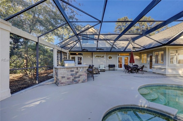 view of patio / terrace featuring a lanai and an outdoor bar