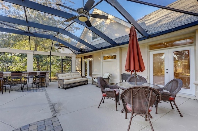 view of patio featuring french doors, ceiling fan, an outdoor hangout area, and an outdoor bar