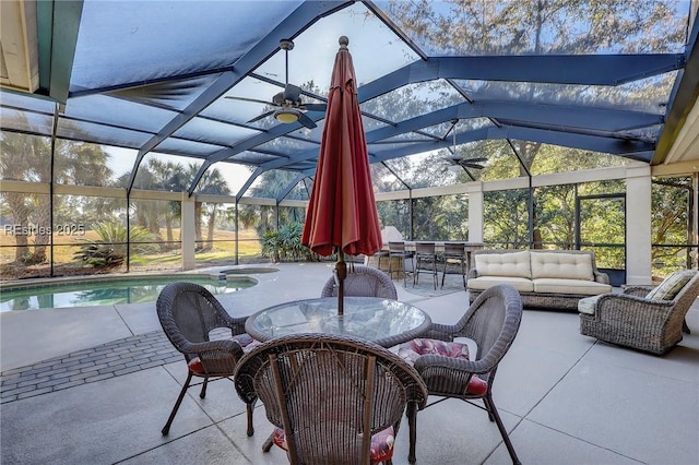 view of patio with a lanai, an outdoor bar, ceiling fan, a pool with hot tub, and an outdoor living space