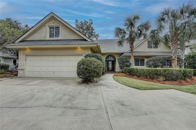 view of front of property with a garage