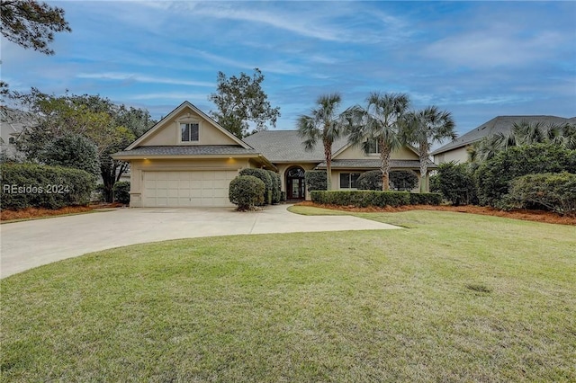 view of front of property with a garage and a front yard