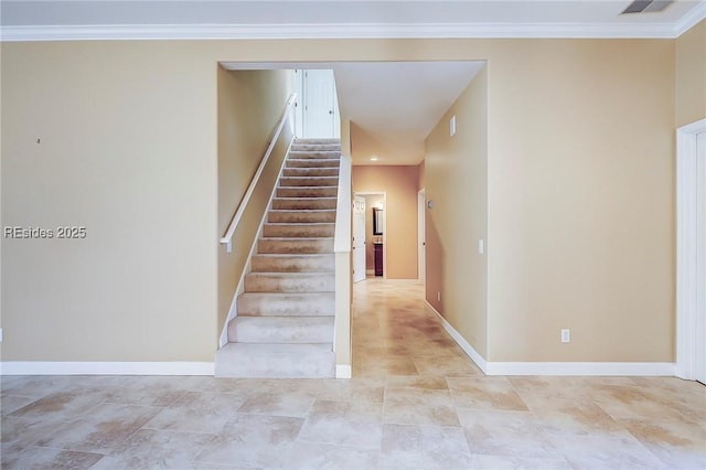 stairway featuring crown molding