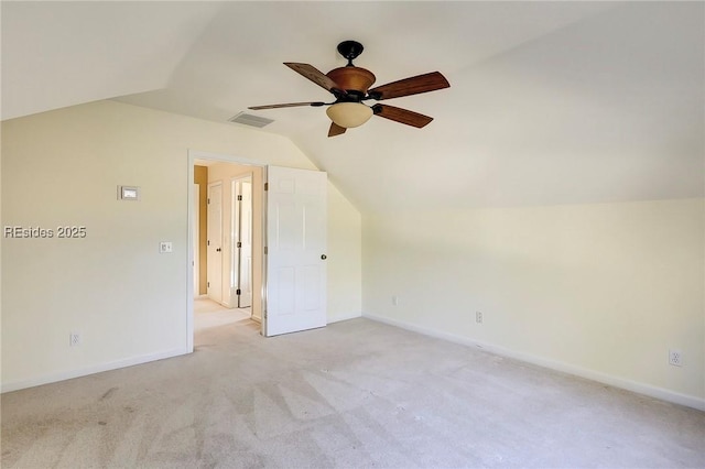 bonus room with lofted ceiling, light carpet, and ceiling fan