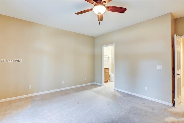 empty room featuring light carpet and ceiling fan