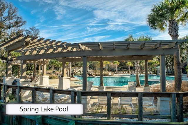 exterior space featuring a pool and a pergola