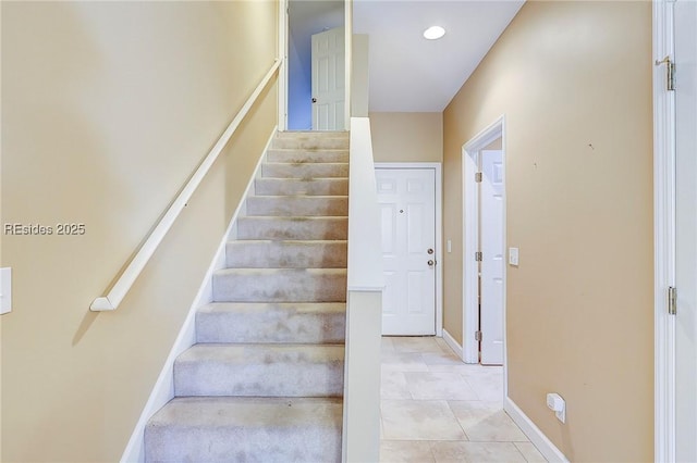 stairs with tile patterned floors