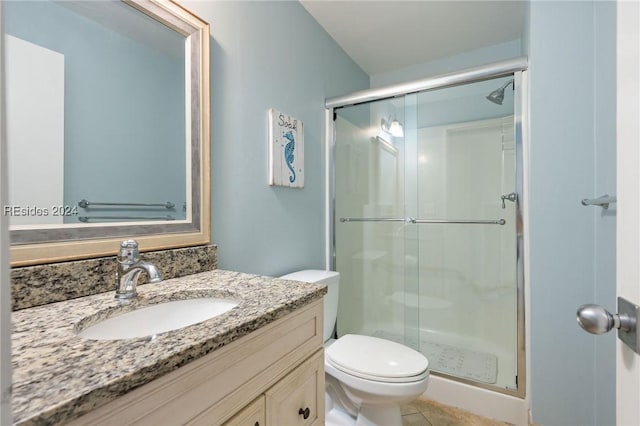 bathroom with vanity, an enclosed shower, tile patterned floors, and toilet