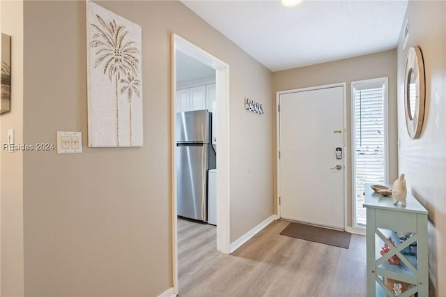 entryway with light wood-type flooring