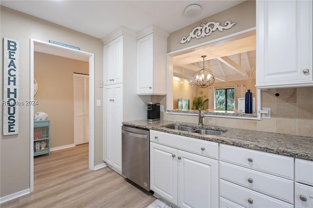 kitchen with sink, dishwasher, white cabinetry, stone countertops, and light wood-type flooring