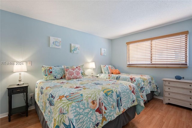 bedroom featuring light hardwood / wood-style flooring