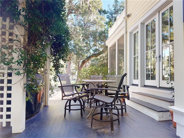 view of patio with french doors and a deck