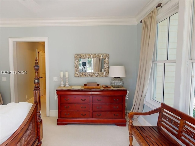 carpeted bedroom featuring ornamental molding