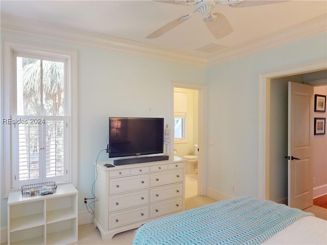 bedroom with crown molding, connected bathroom, and ceiling fan