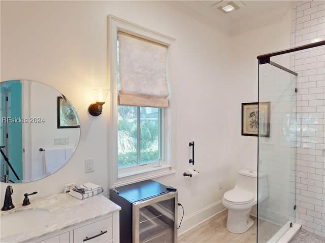 bathroom with wine cooler, vanity, crown molding, and an enclosed shower