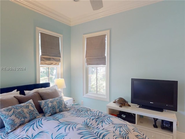 bedroom featuring multiple windows, crown molding, and ceiling fan