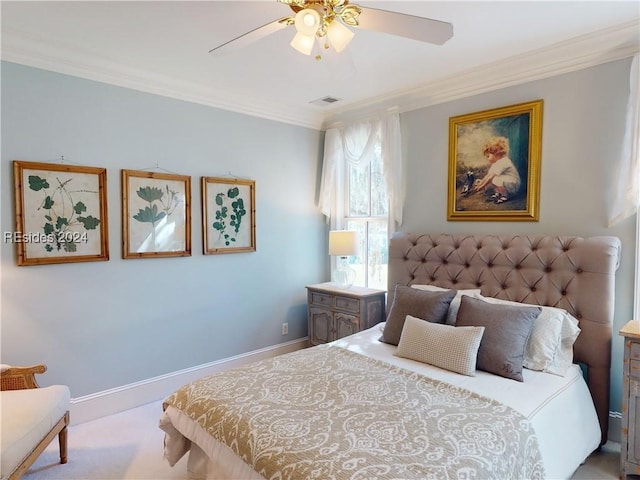 bedroom featuring light colored carpet, ornamental molding, and ceiling fan