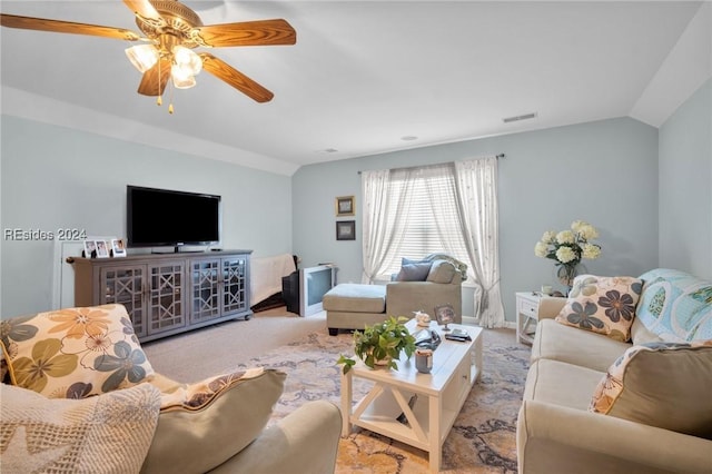 living room featuring light carpet, vaulted ceiling, and ceiling fan