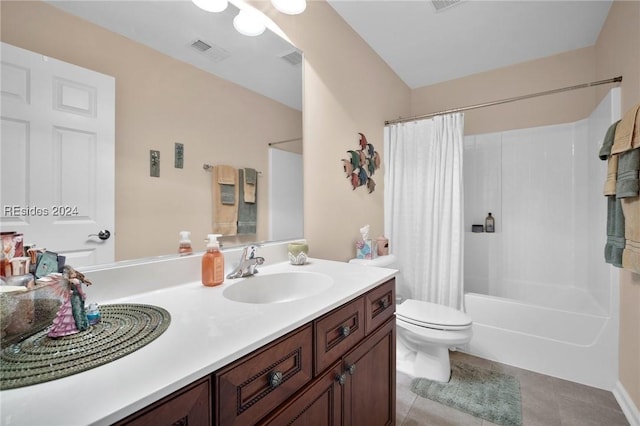 full bathroom featuring vanity, toilet, tile patterned flooring, and shower / bath combo with shower curtain