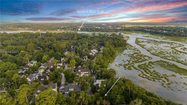 aerial view at dusk with a water view