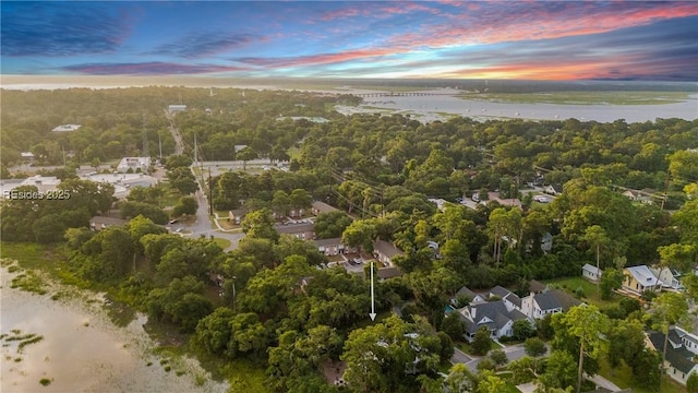 aerial view at dusk with a water view