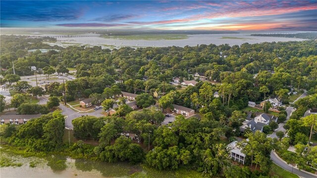 aerial view at dusk with a water view