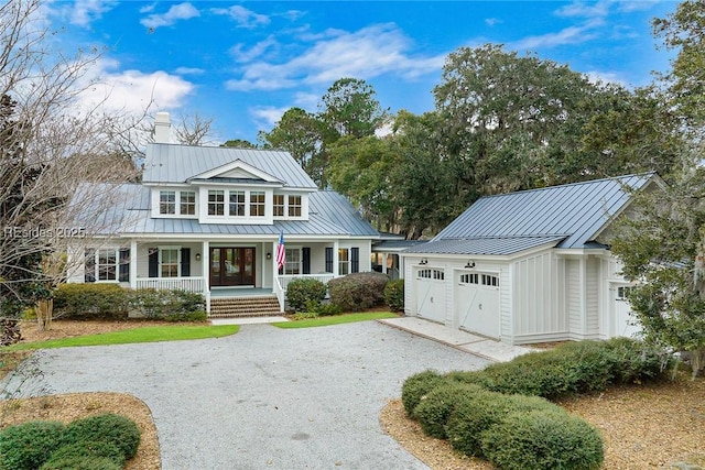 view of front of property with a garage and a porch