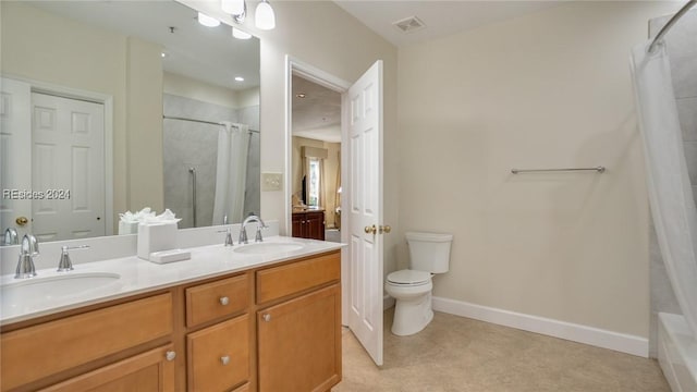 full bathroom with vanity, shower / bath combo, and toilet