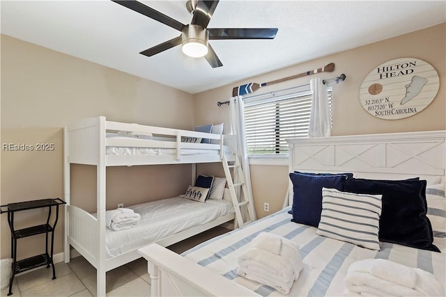 bedroom featuring ceiling fan and light tile patterned floors