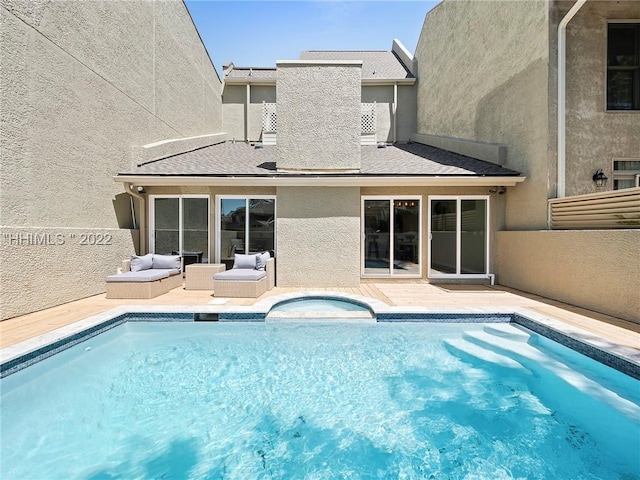 view of swimming pool with an outdoor hangout area, a patio area, and a jacuzzi