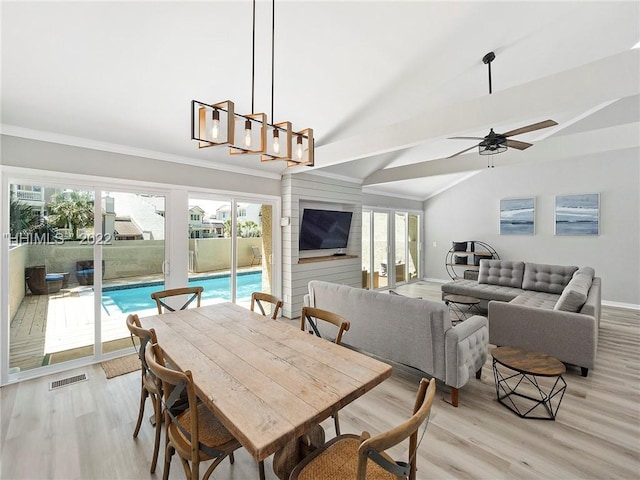 dining space featuring vaulted ceiling, ceiling fan, and light hardwood / wood-style floors