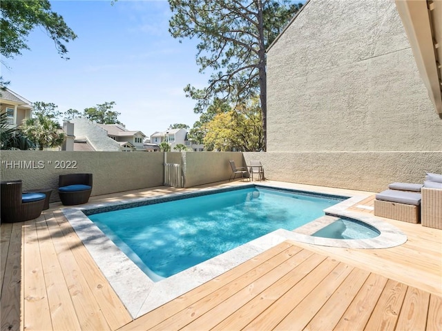 view of swimming pool with a deck