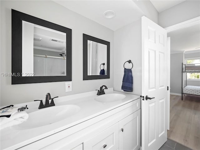 bathroom with vanity and crown molding