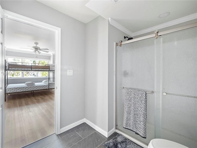 bathroom with crown molding, ceiling fan, tile patterned floors, and walk in shower