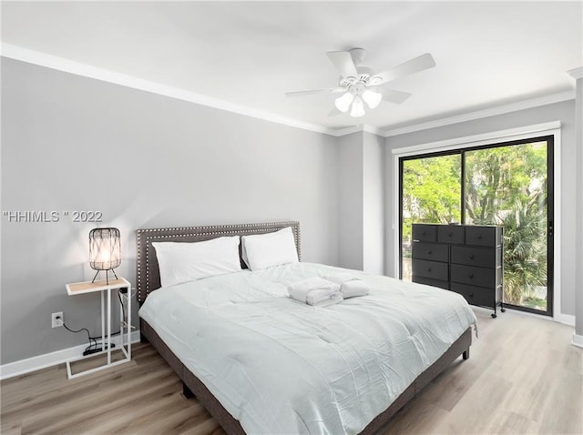 bedroom with ceiling fan, ornamental molding, and hardwood / wood-style floors