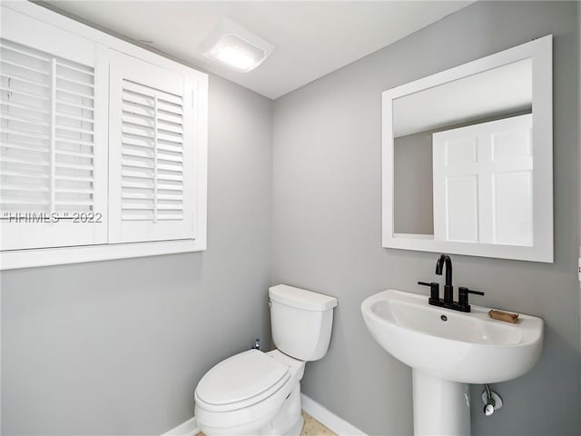 bathroom with sink and toilet