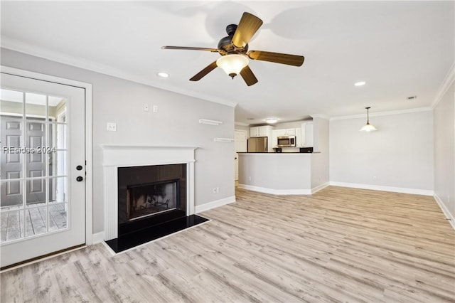 unfurnished living room with crown molding, ceiling fan, and light hardwood / wood-style flooring