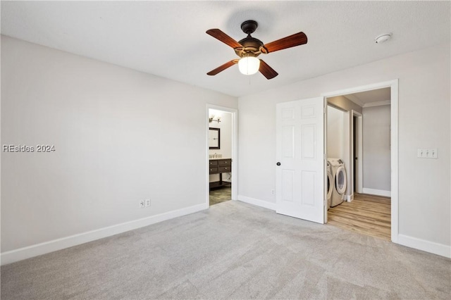 unfurnished bedroom with ensuite bathroom, light colored carpet, ornamental molding, ceiling fan, and washer and clothes dryer