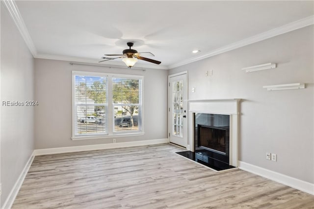 unfurnished living room with ornamental molding, ceiling fan, and light wood-type flooring