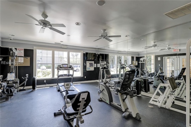 workout area featuring ceiling fan and french doors