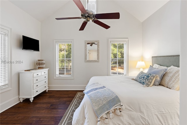 bedroom with ceiling fan, dark hardwood / wood-style floors, high vaulted ceiling, and multiple windows