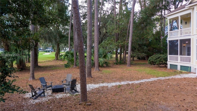 view of yard with a fire pit