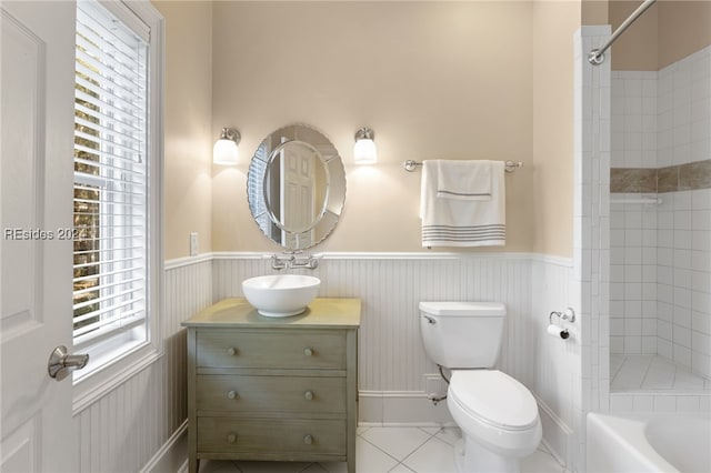 full bathroom featuring toilet, tile patterned floors, vanity, and shower with separate bathtub