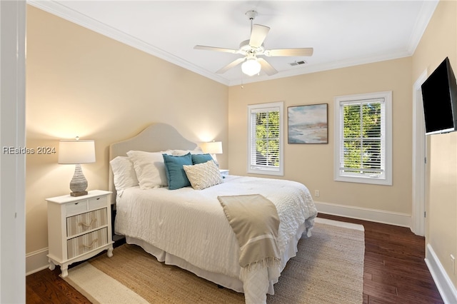 bedroom featuring ornamental molding, dark wood-type flooring, and ceiling fan