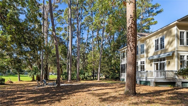 view of yard featuring a wooden deck