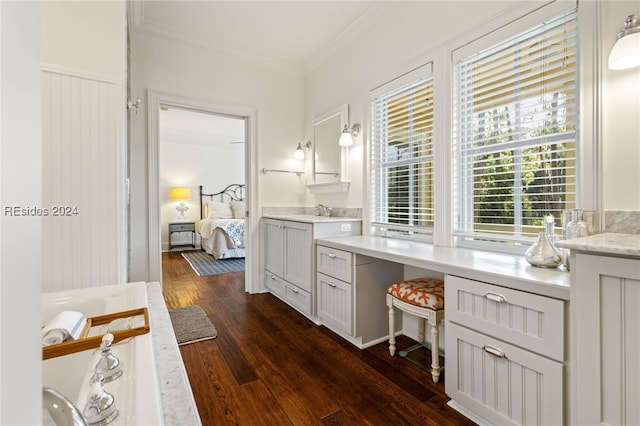 bathroom featuring wood-type flooring, vanity, and crown molding