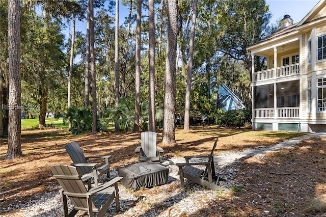 view of yard featuring a balcony