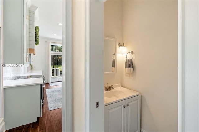 bathroom featuring vanity and hardwood / wood-style floors