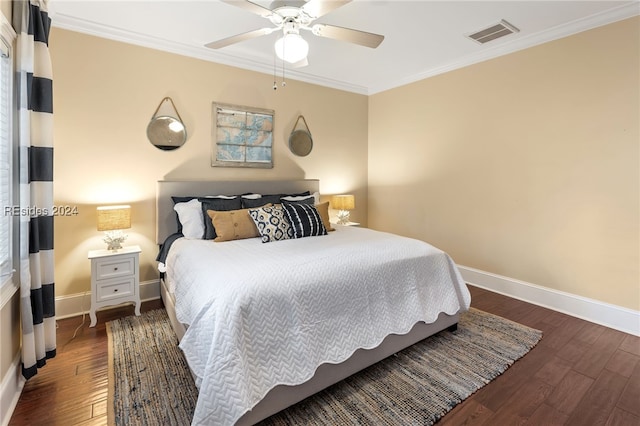 bedroom with ceiling fan, ornamental molding, and dark hardwood / wood-style flooring