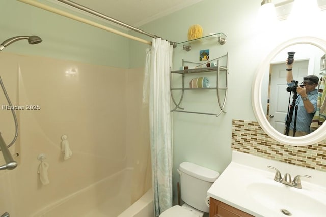 full bathroom featuring tasteful backsplash, vanity, toilet, crown molding, and shower / bath combo with shower curtain