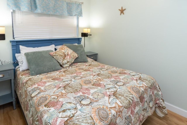 bedroom featuring hardwood / wood-style floors